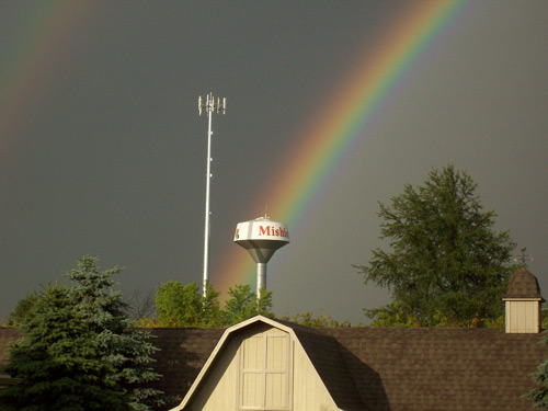 Rainbow over water tower